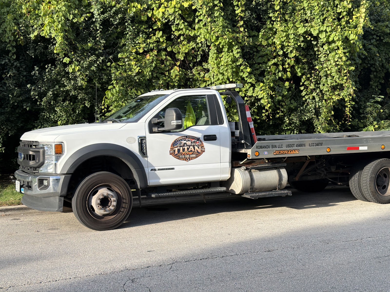 TITAN TOW’s white flatbed truck